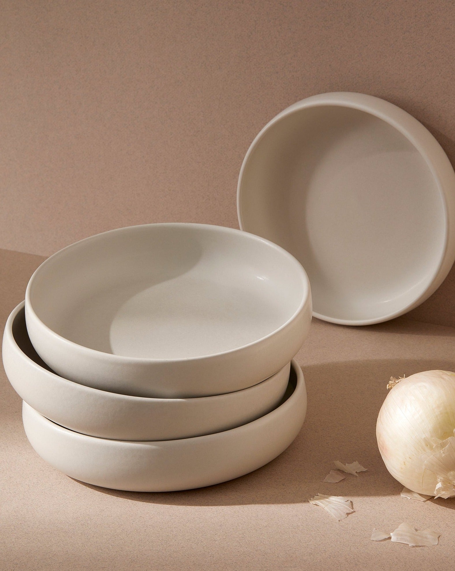 handmade, artisan made, matte WHITE, matte finish, plate, dinner plate, pasta plate, salad plate, assiette à diner, assiette à pate, salad plate, blanc mat, artisan made fait à la main, arisanal, intemporel, design, EDAN, gharyan stoneware, ethically made, ethique, fair trade, commerce équitabledinnerware, service de vaisselle, dinner set, dinnerware set, le gourmand, ensemble de vaissellelle